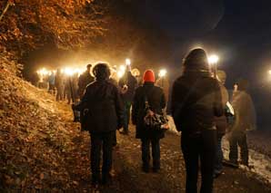 Torchlight walk to Christmas dinner with plait baking