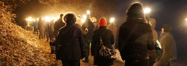 Torchlight walk to Christmas dinner with plait baking