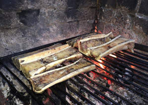 Cooking over the fire at a traditional oven house