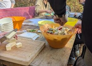 Team cooking over an open fire