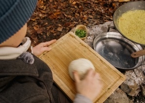 Team cooking over an open fire