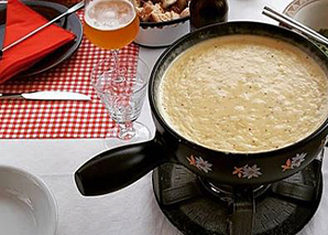 Fondue fork forging with fondue in Bern