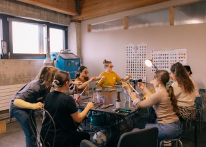 Turning glass beads in a team